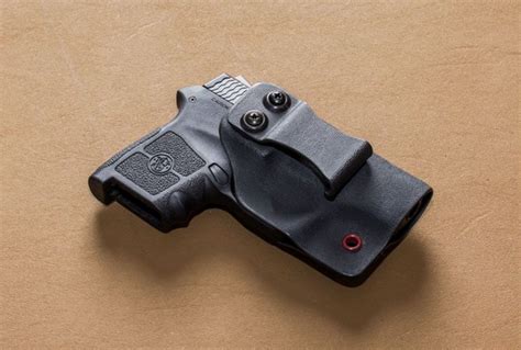 On your six designs holster - On Your 6 Designs Paddle Holster. The Perfect Fusion of OWB Convenience and IWB Speed! Crafted from durable 0.090 thick Kydex, this holster handles heavier firearms with ease. What Sets Us Apart: Customized Fit: Adjustable retention for your preferred level of security. Tried and Tested: Meticulously designed, tested, and worn by our experts. 